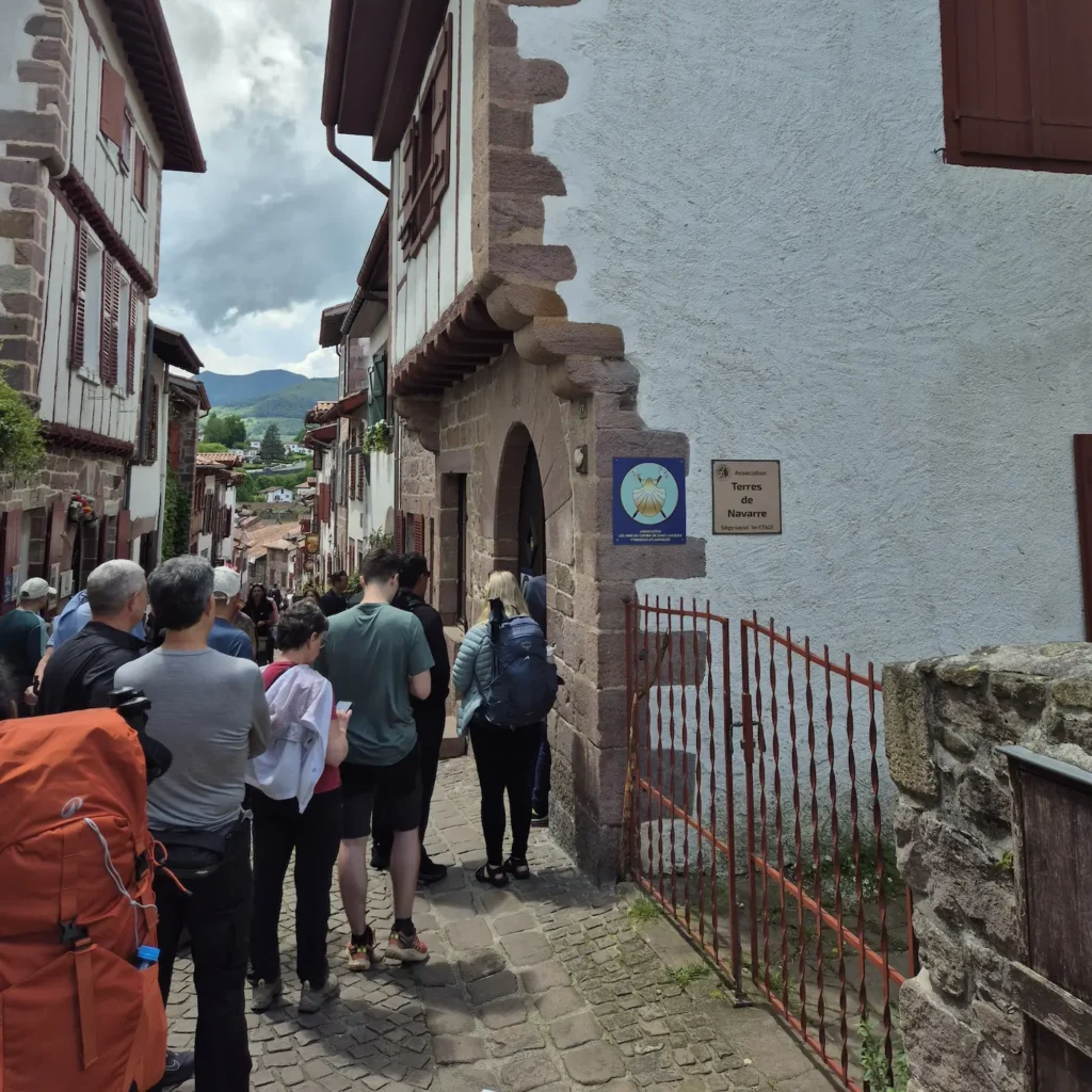 Pilgrims queuing to register at the Camino de Santiago pilgrim office in Saint-Jean-Pied-de-Port