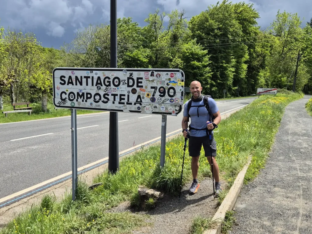 Simon with the 790km Camino de Santiago sign near Roncesvalles