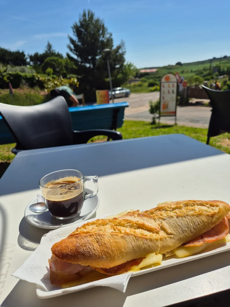 Coffee with a ham and cheese baguette