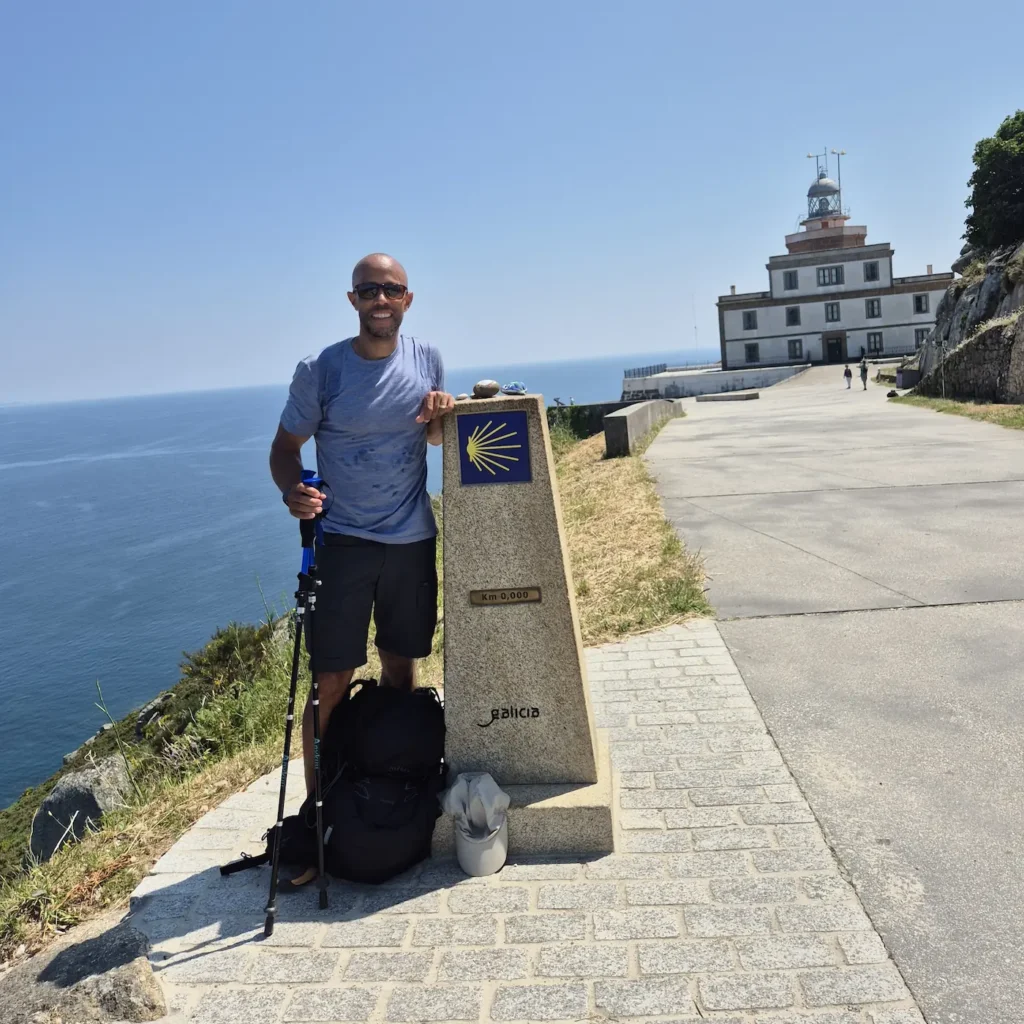 Simon at the 0km Camino de Santiago marker at Faro de Cabo Finisterre