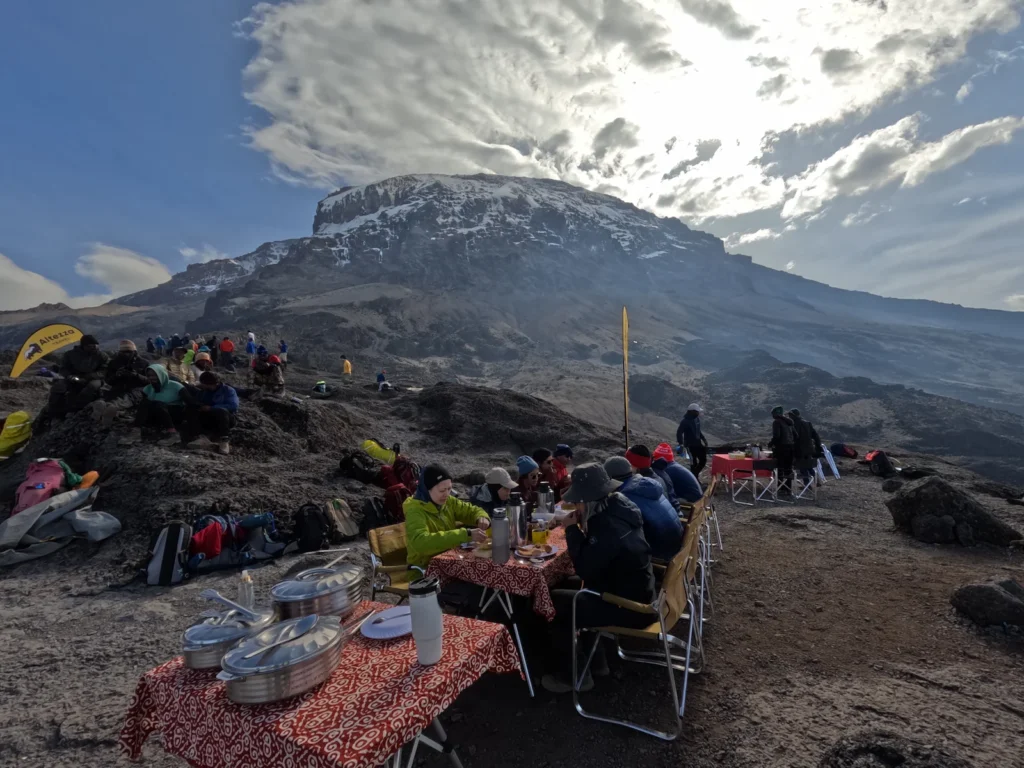 Hikers having lunch at the top of Barranco Wall on Kilimanjaro