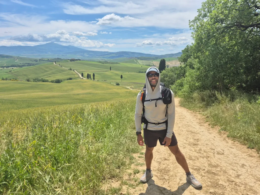 Simon standing on a long gravel path